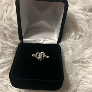 Silver & clear stone heart ring .